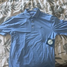 Photo of the blue polo shirt being appraised
